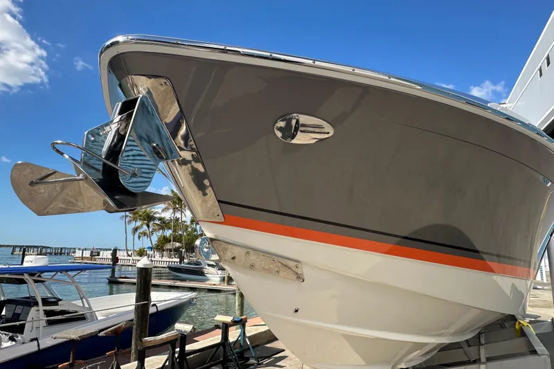 Slide: The Image of 2024 Formula 387 Center Console Fish boat docked under clear blue sky. - 3