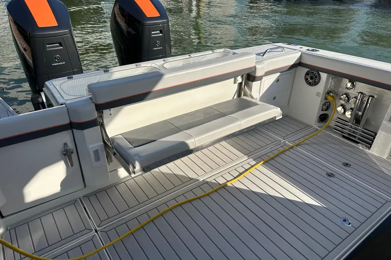 Slide: The Image of 2024 Formula 387 Center Console Fish boat interior with seating and dual Mercury Verado engines. - 32