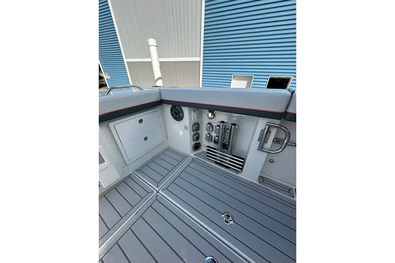 Slide: The Image of 2024 Formula 387 Center Console Fish boat interior with storage and control panel. - 33