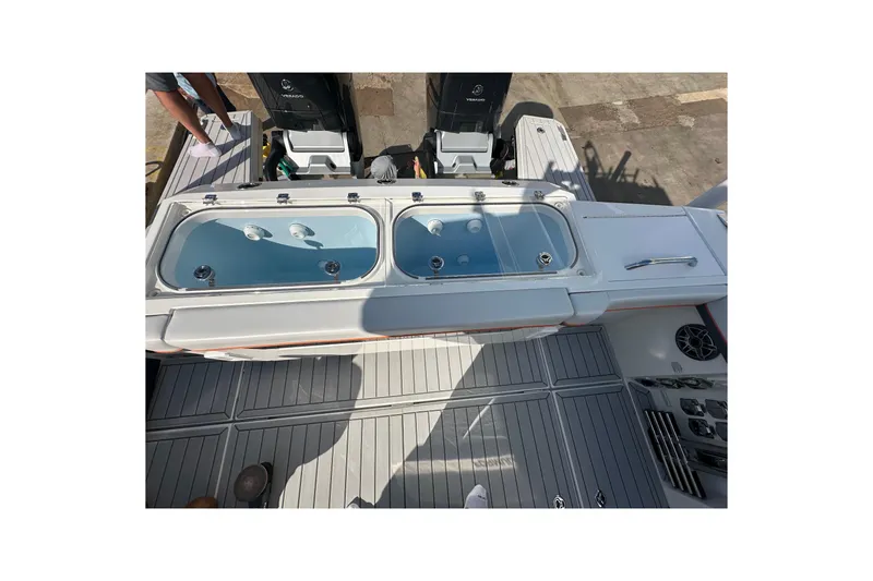 Slide: The Image of 2024 Formula 387 Center Console Fish boat with dual livewells and outboard engines. - 36