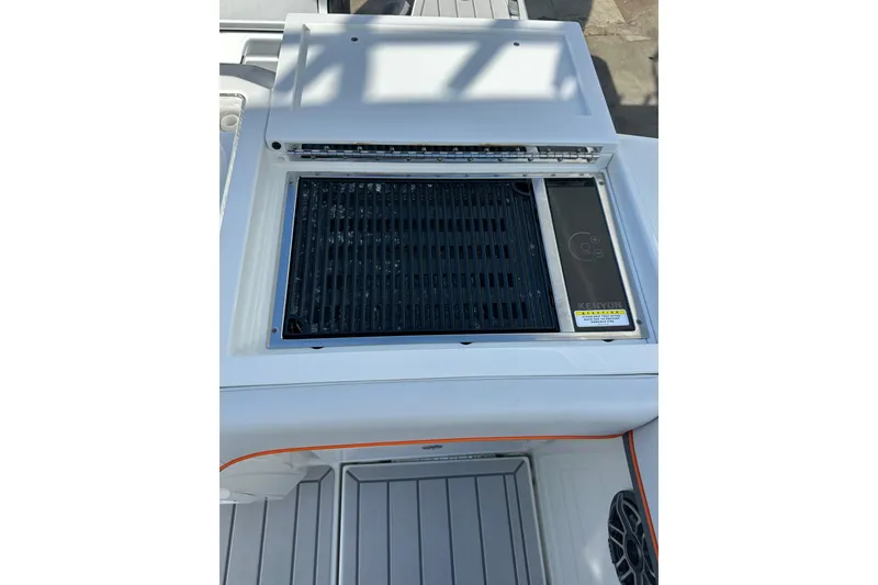 Slide: The Image of 2024 Formula 387 Center Console Fish grill and control panel on deck. - 45