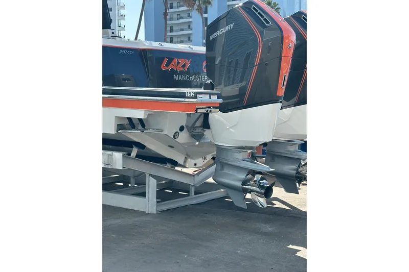 Slide: The Image of 2024 Formula 387 Center Console Fish boat with Mercury engines, docked in a marina. - 6