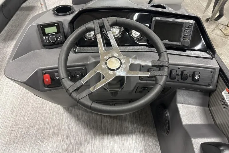 Slide: The Image of 2026 Bennington 22 SSRSF boat dashboard with steering wheel and control panel. - 12