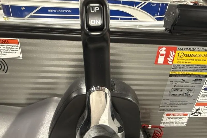 Slide: The Image of Throttle control of 2026 Bennington 22 SSRSF boat with capacity warning labels. - 13