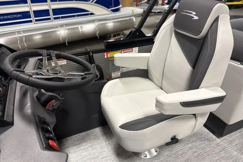 Slide: The Image of Captain's chair and steering wheel of 2026 Bennington 22 SSRSF pontoon boat. - 14