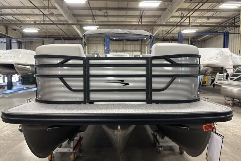 Slide: The Image of 2026 Bennington 22 SSRSF pontoon boat in a showroom setting. - 7
