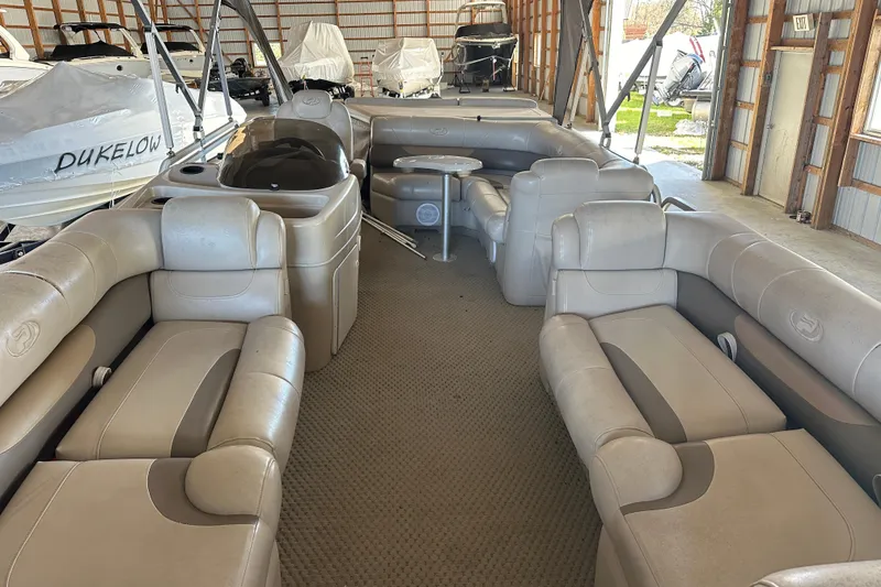 Slide: The Image of 2008 Princecraft Vectra 200 L pontoon boat interior with beige seating in storage. - 4