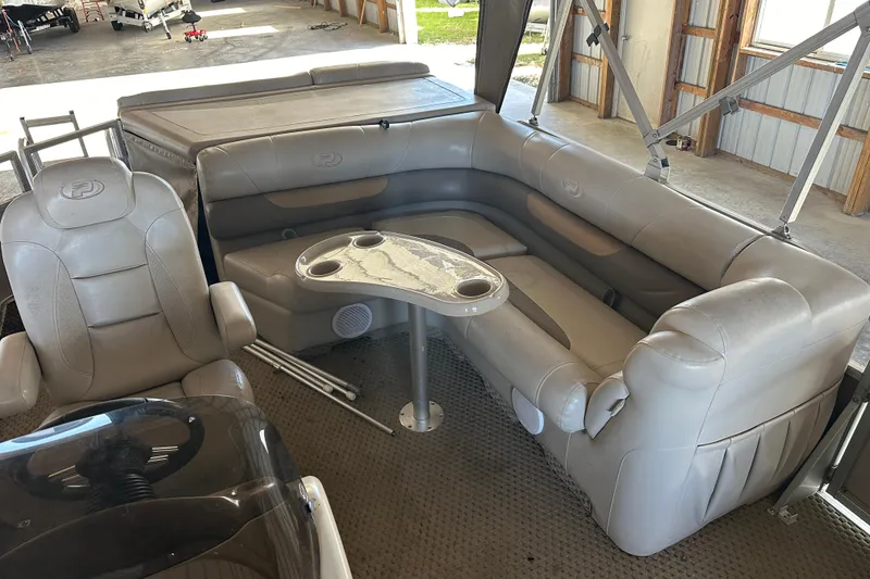 Slide: The Image of 2008 Princecraft Vectra 200 L pontoon boat interior with beige seating and table. - 5