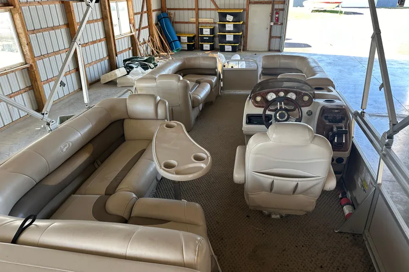 Slide: The Image of 2008 Princecraft Vectra 200 L pontoon boat interior with beige seating and steering console. - 7