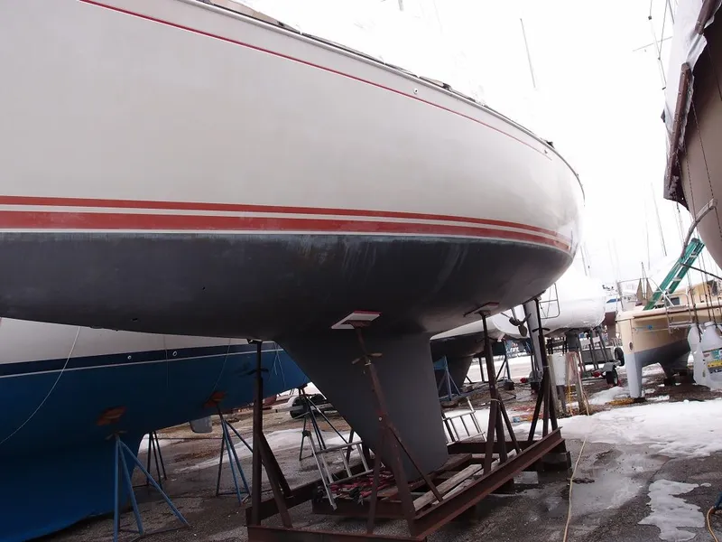 Slide: The Image of 1985 C&C 37 sailboat on a dry dock. - 16