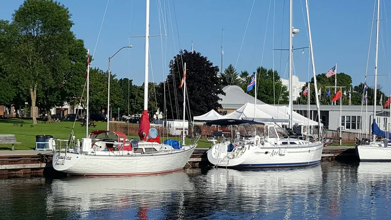 Slide: The Image of Sailboats docked, including a 1985 C&C 37 model. - 2