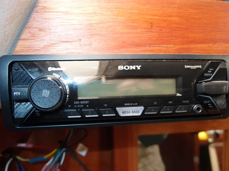 Slide: The Image of Sony car stereo with Bluetooth and Mega Bass in wooden panel. - 22