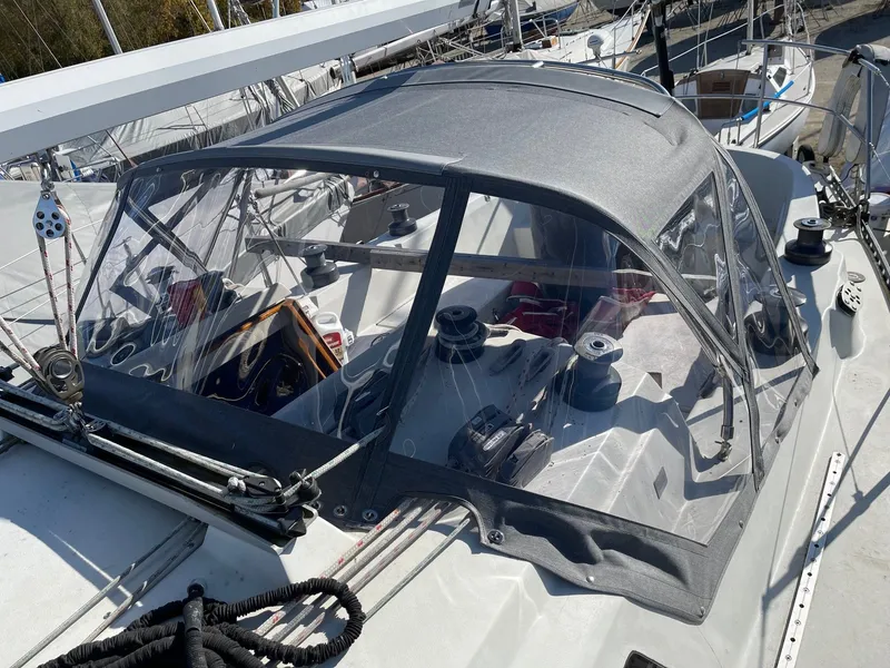 Slide: The Image of 1985 C&C 37 sailboat with cockpit cover in harbor. - 4