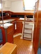 Slide: The Image of Interior of a 1985 C&C 37 yacht with wooden furnishings. - 5