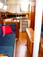 Slide: The Image of Interior of a 1985 C&C 37 sailboat with wooden furnishings. - 6