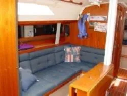 Slide: The Image of Interior of a 1985 C&C 37 yacht with blue upholstery. - 7
