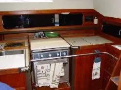 Slide: The Image of Galley area of a 1985 C&C 37 yacht with wood finish. - 8