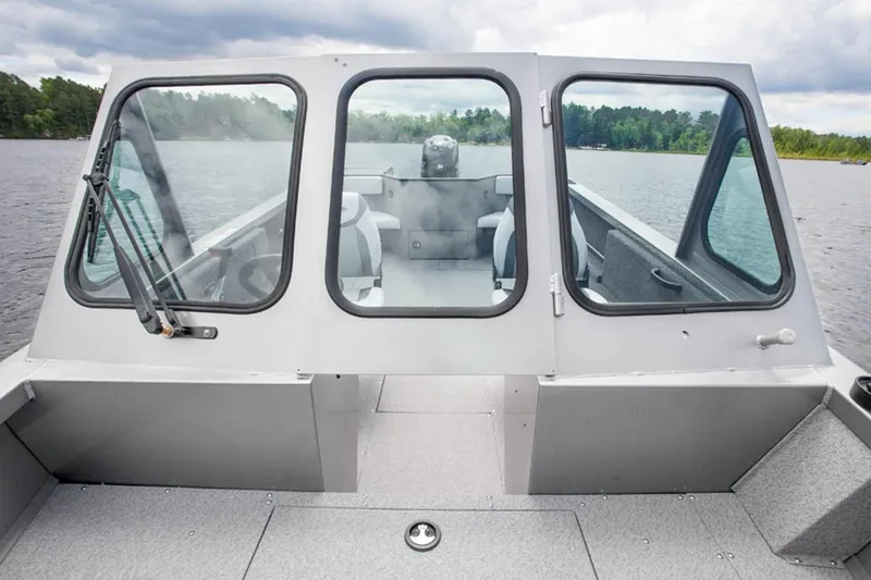 Slide: The Image of Manufacturer Provided Image: 2015 Crestliner 1850 Commander boat on a lake with a view of the cockpit. - 11