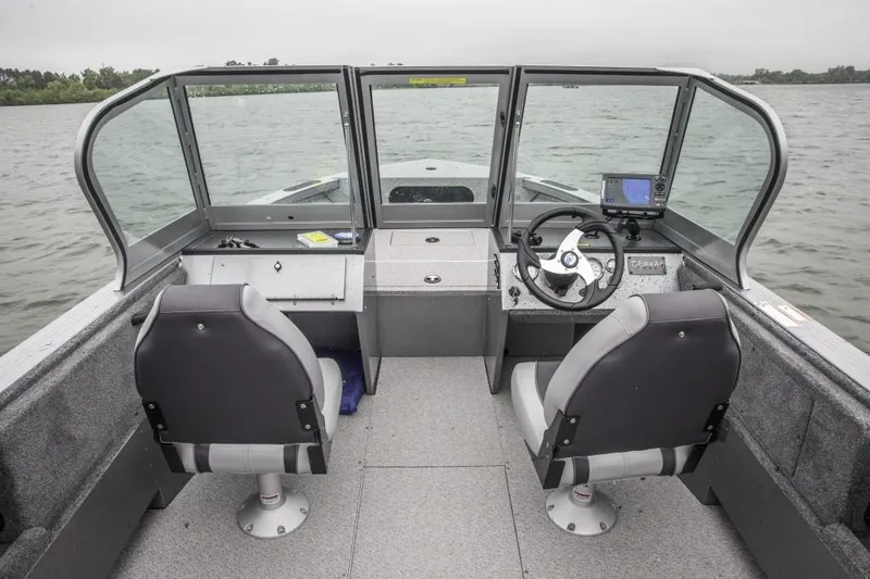 Slide: The Image of Manufacturer Provided Image: 2015 Crestliner 1850 Commander boat interior with dual seats and steering console. - 12