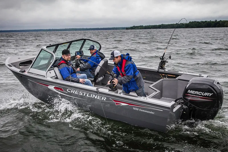 Slide: The Image of Manufacturer Provided Image: 2015 Crestliner 1850 Commander boat on water with three people fishing. - 7