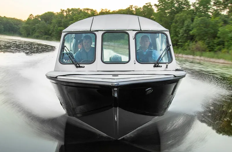 Slide: The Image of Manufacturer Provided Image: 2015 Crestliner 1850 Commander boat cruising on a lake. - 9