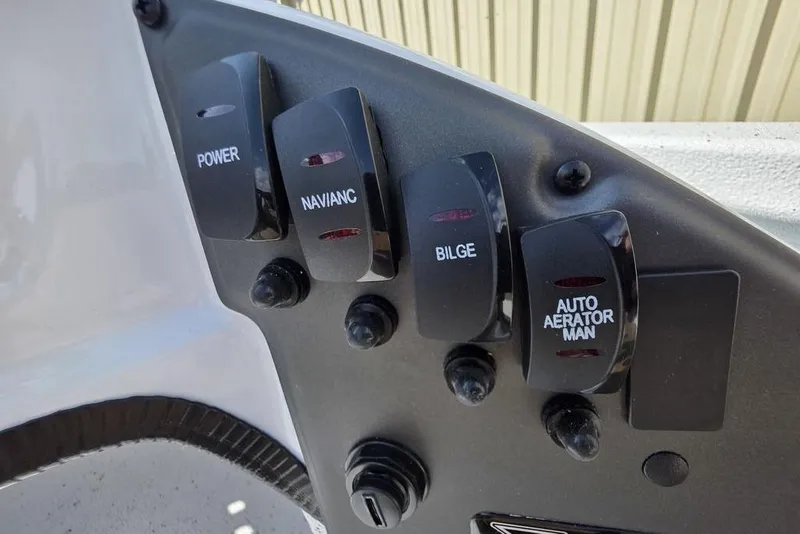 Slide: The Image of Control panel of 2026 Xpress H18 boat with labeled switches for power, navigation, bilge, and aerator. - 11