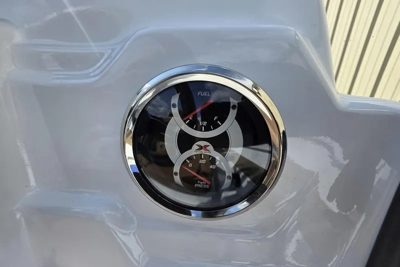 Slide: The Image of Dashboard gauges on 2026 Xpress H18 boat, displaying fuel and pressure levels. - 13