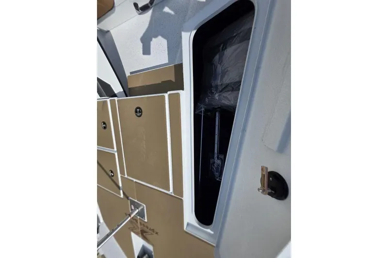 Slide: The Image of 2026 Xpress H18 boat interior storage compartment with sleek design and secure latch. - 20
