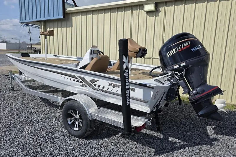 Slide: The Image of 2026 Xpress H18 boat with Yamaha engine on trailer, parked outdoors. - 3