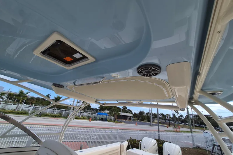 Slide: The Image of 2026 Grady-White Freedom 307 boat interior, featuring a sleek roof design and modern amenities. - 10