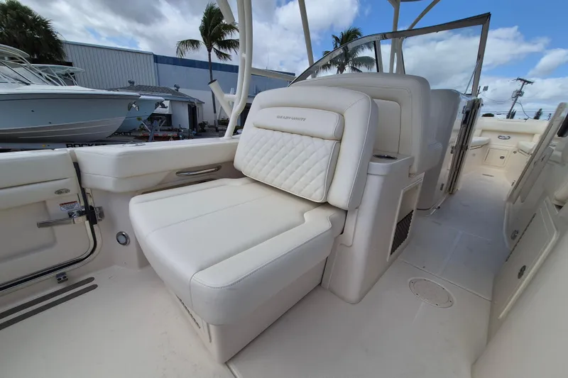 Slide: The Image of 2026 Grady-White Freedom 307 boat interior with luxurious seating and modern design. - 18