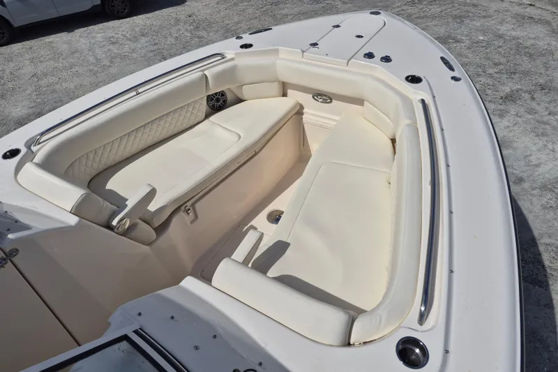 Slide: The Image of 2026 Grady-White Freedom 307 boat interior with white cushioned seating. - 4