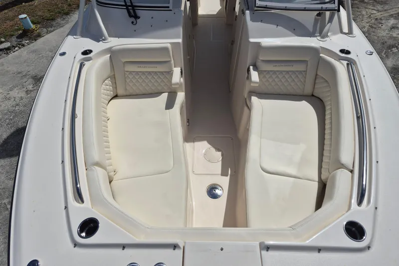 Slide: The Image of 2026 Grady-White Freedom 307 boat interior with luxurious seating and sleek design. - 8
