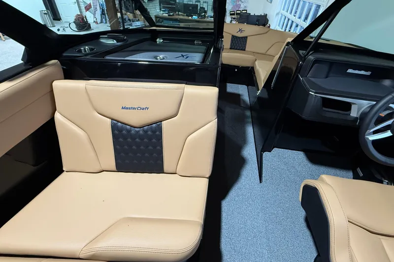 Slide: The Image of 2026 MasterCraft XT24 interior with tan leather seats and modern design. - 3