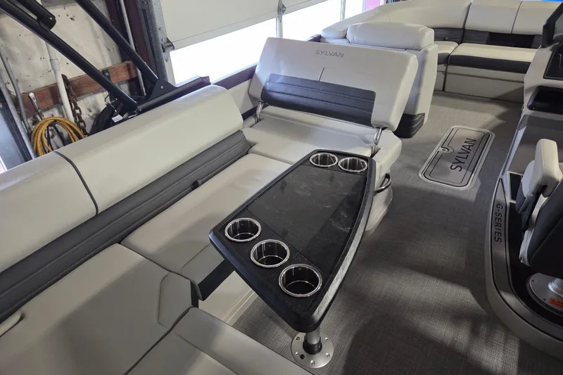 Slide: The Image of Interior of 2025 Sylvan G3 CLZ boat with luxurious seating and cup holders. - 10