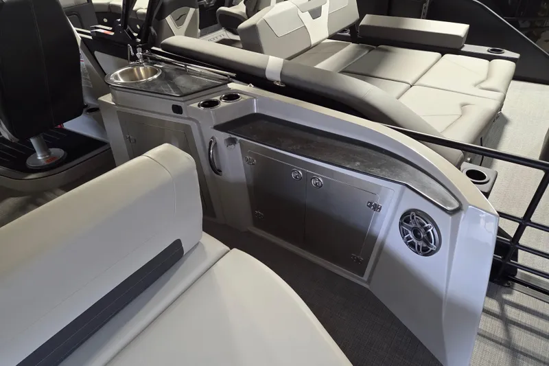 Slide: The Image of 2025 Sylvan G3 CLZ boat interior with seating, sink, and storage compartments. - 12