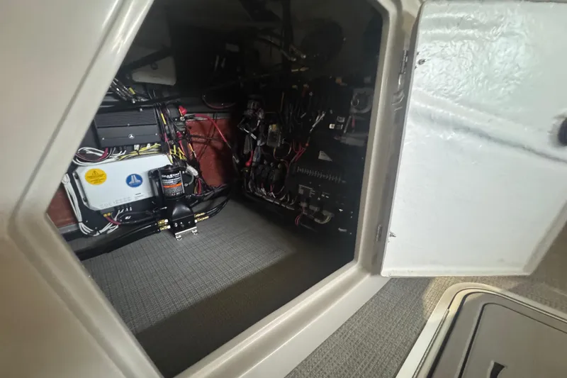 Slide: The Image of Electrical compartment of 2025 Sylvan G3 CLZ boat, showcasing wiring and components. - 17