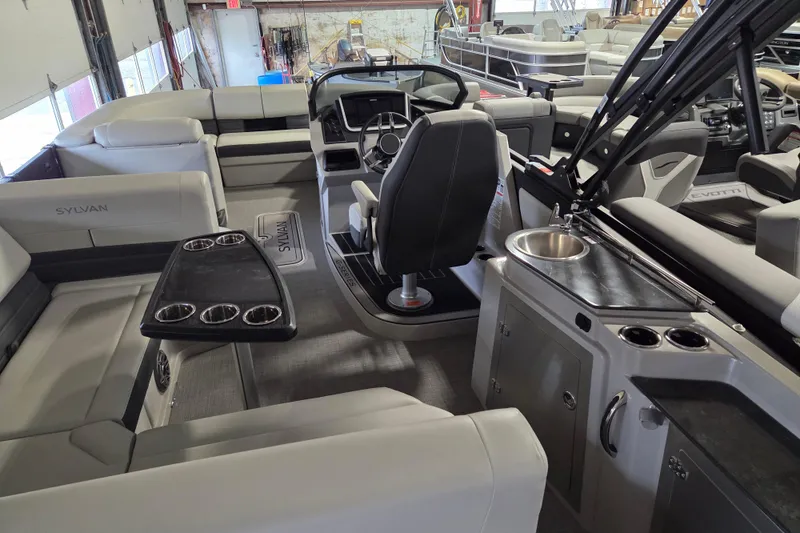 Slide: The Image of Interior of 2025 Sylvan G3 CLZ pontoon boat with seating, helm, and sink. - 23