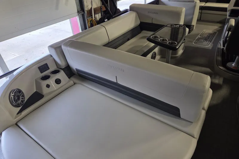 Slide: The Image of 2025 Sylvan G3 CLZ boat interior with plush seating and cup holders. - 26