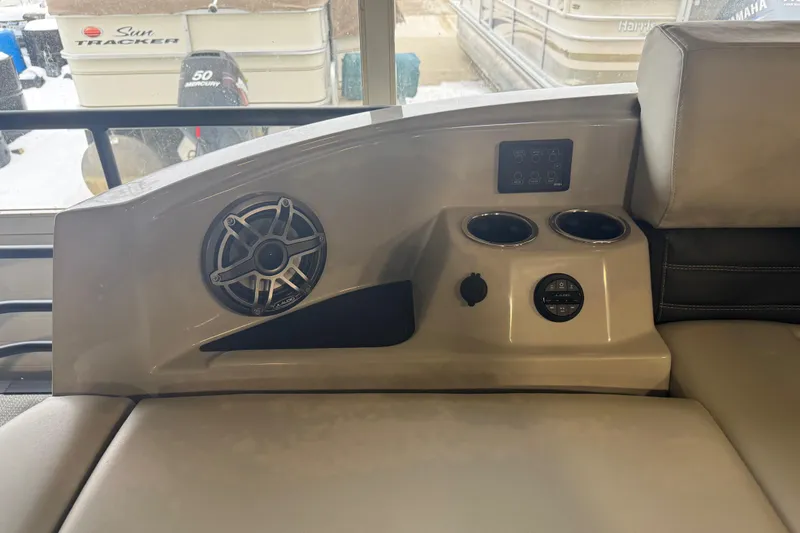 Slide: The Image of 2025 Sylvan G3 CLZ boat interior with speaker, cup holders, and control panel. - 30