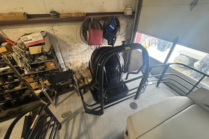 Slide: The Image of 2025 Sylvan G3 CLZ boat interior in a workshop with equipment and tools. - 31