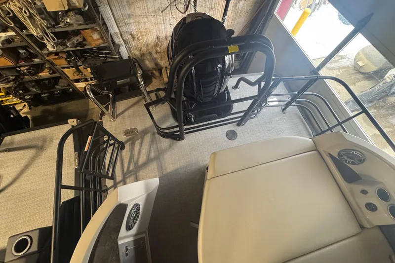 Slide: The Image of Interior view of 2025 Sylvan G3 CLZ boat, showcasing seating and engine area. - 33