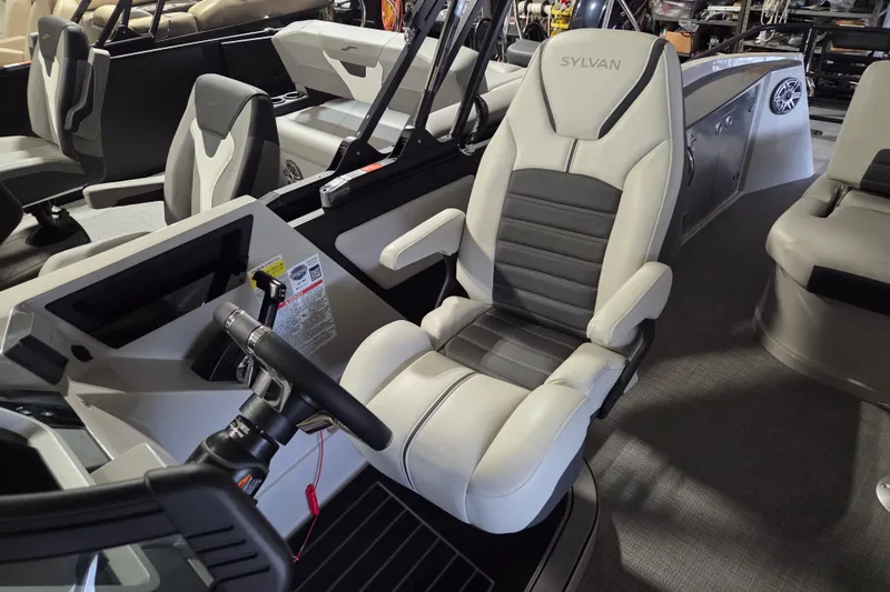 Slide: The Image of 2025 Sylvan G3 CLZ boat interior with modern seating and steering wheel. - 6