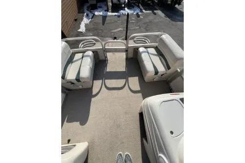 Slide: The Image of 2011 Sun Tracker Party Barge 20 DLX interior with seating and open deck space. - 4