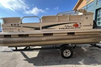 Slide: The Image of 2011 Sun Tracker Party Barge 20 DLX pontoon boat on trailer, side view. - 6