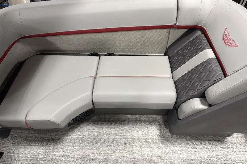 Slide: The Image of 2026 Bennington 23 MFBSF boat interior with gray and red cushioned seating. - 10