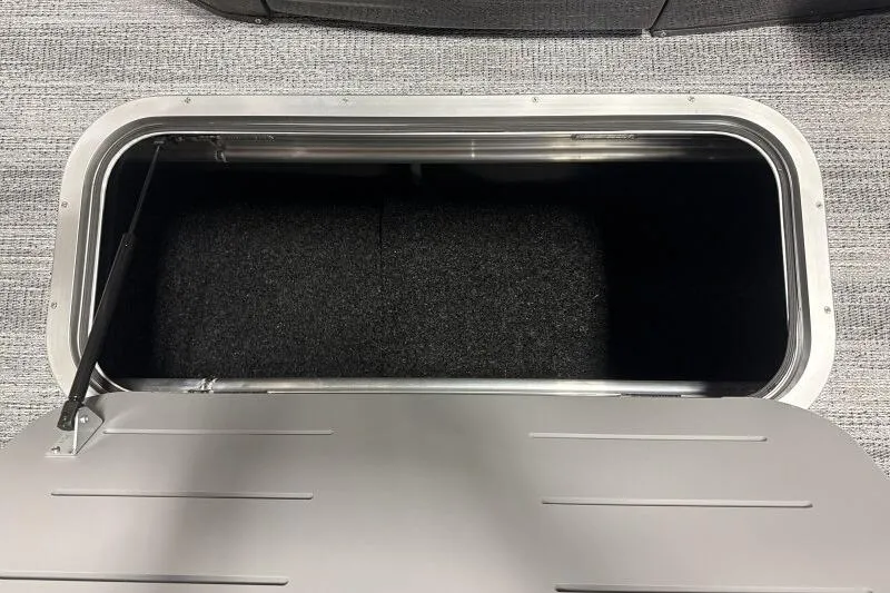 Slide: The Image of Storage compartment of 2026 Bennington 23 MFBSF boat, open with visible interior. - 16