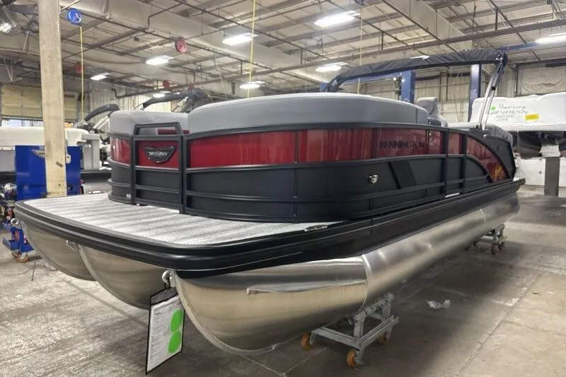 Slide: The Image of 2026 Bennington 23 MFBSF pontoon boat in a warehouse setting. - 4