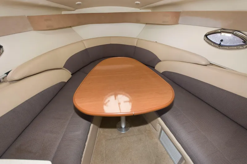 Slide: The Image of Interior of 2006 Maxum 2600 SE with table and seating area. - 10