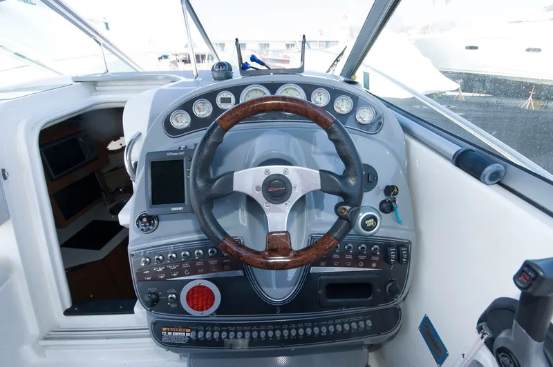 Slide: The Image of Helm console of a 2006 Maxum 2600 SE boat. - 2